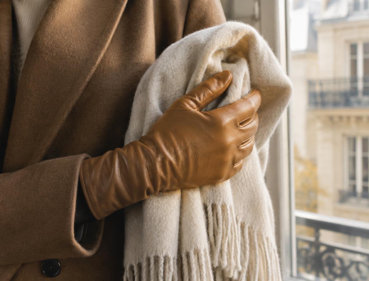 Camel leather gloves in warm Parisian light
